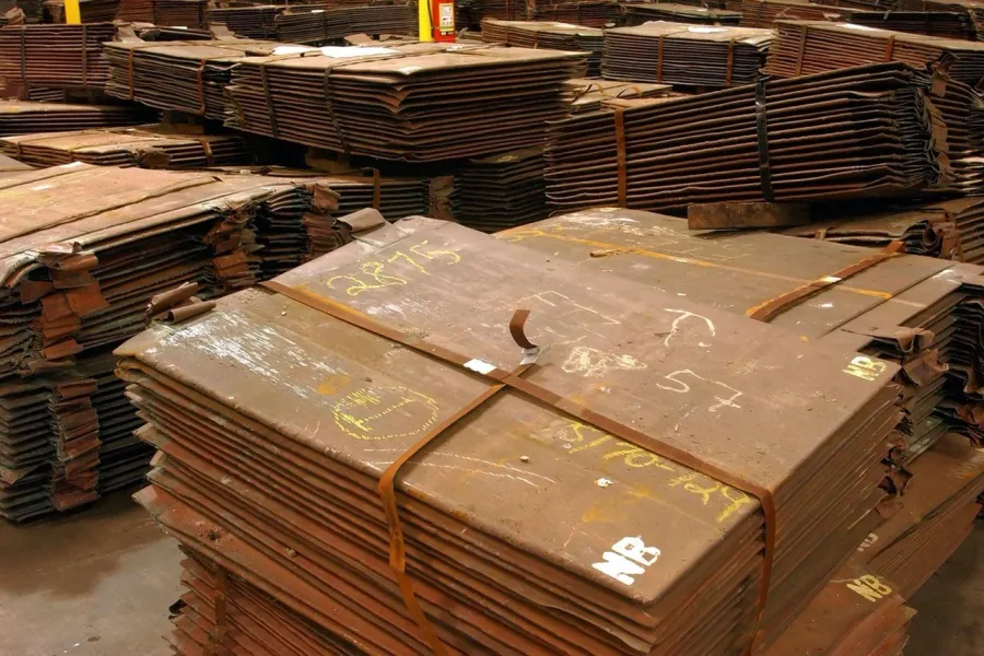 LME copper cathodes stacked high in a warehouse
