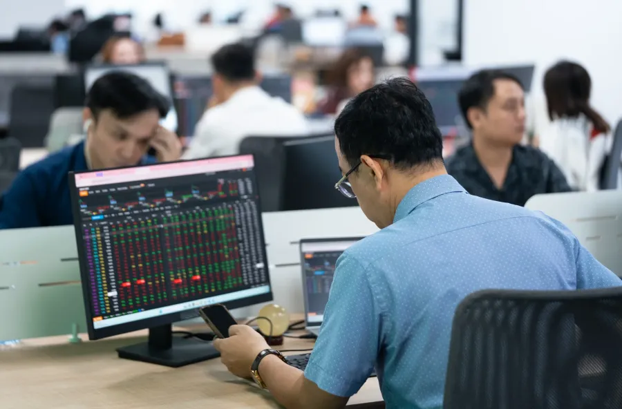 Retail investor monitoring the trading board
