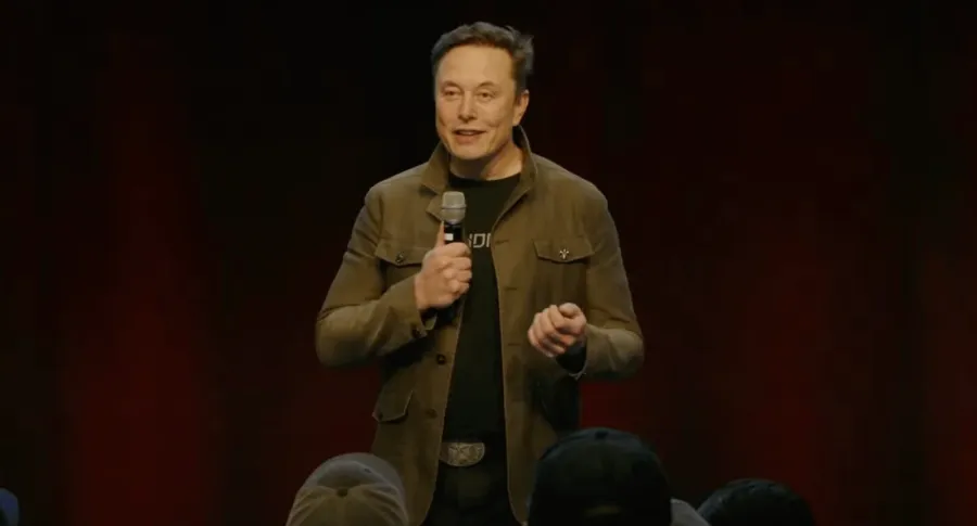 Elon Musk speaking at a Tesla event
