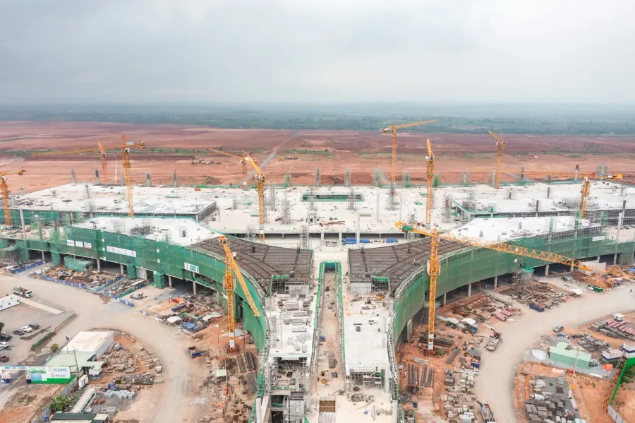 Long Thanh terminal under construction — the lotus-shaped steel roof frame taking shape