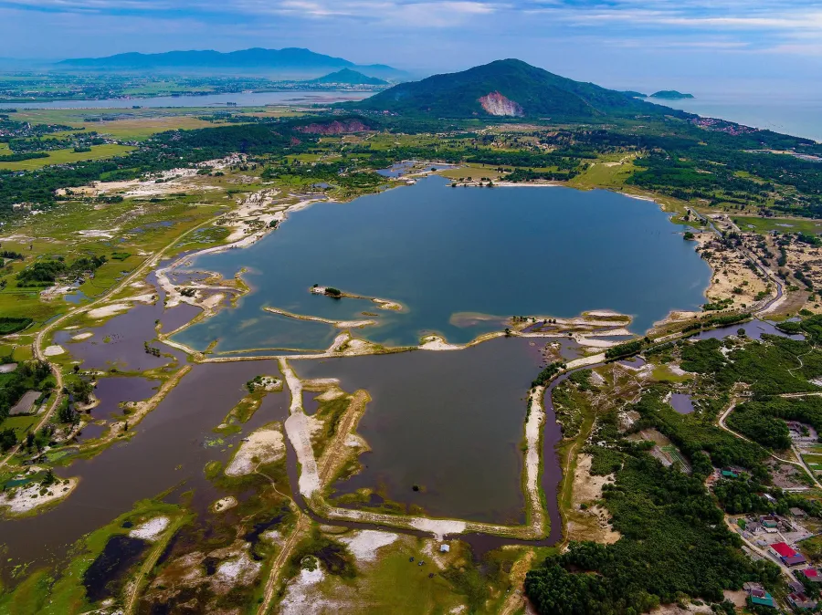 Aerial view of the Thach Khe mine site, with the sea visible in the background