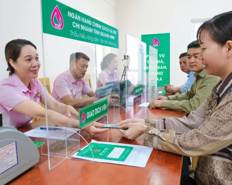 Borrowers handling loan paperwork