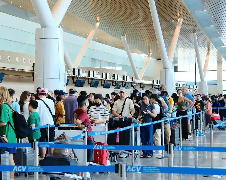 Passengers checking in at an airport operated by ACV