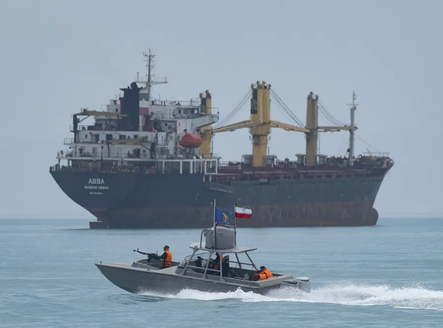 Patrol boat and commercial vessel near Hormuz
