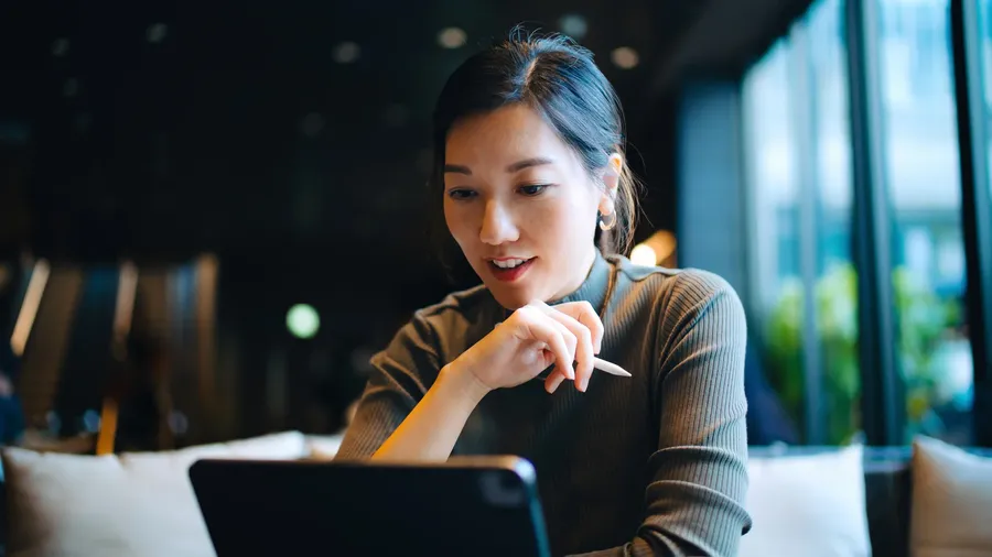 An investor reviewing financial information on a digital device