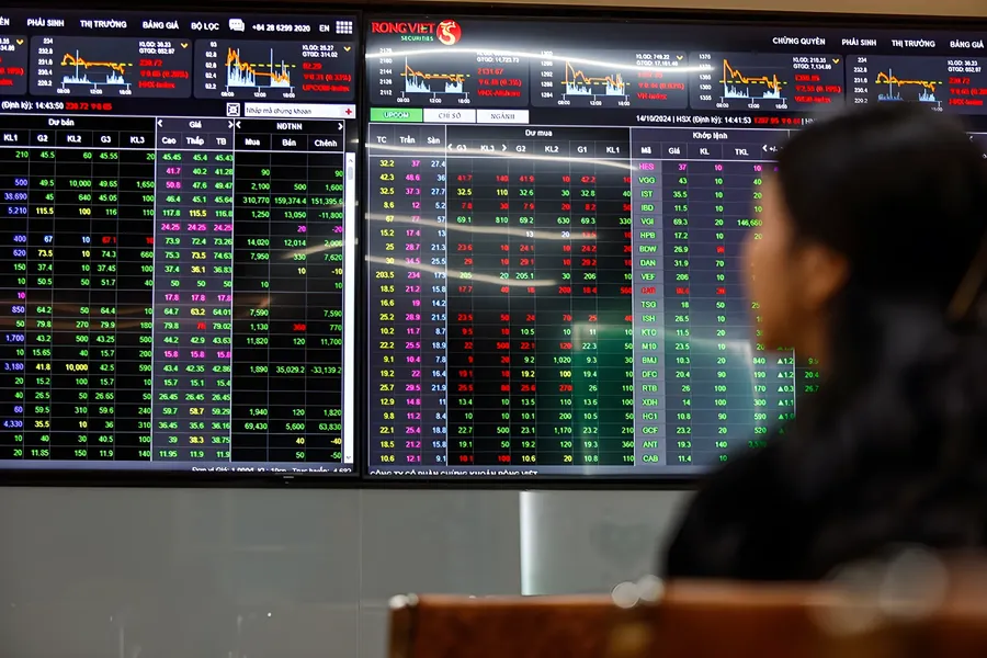 Investor watching Vietnamese stock-market screens