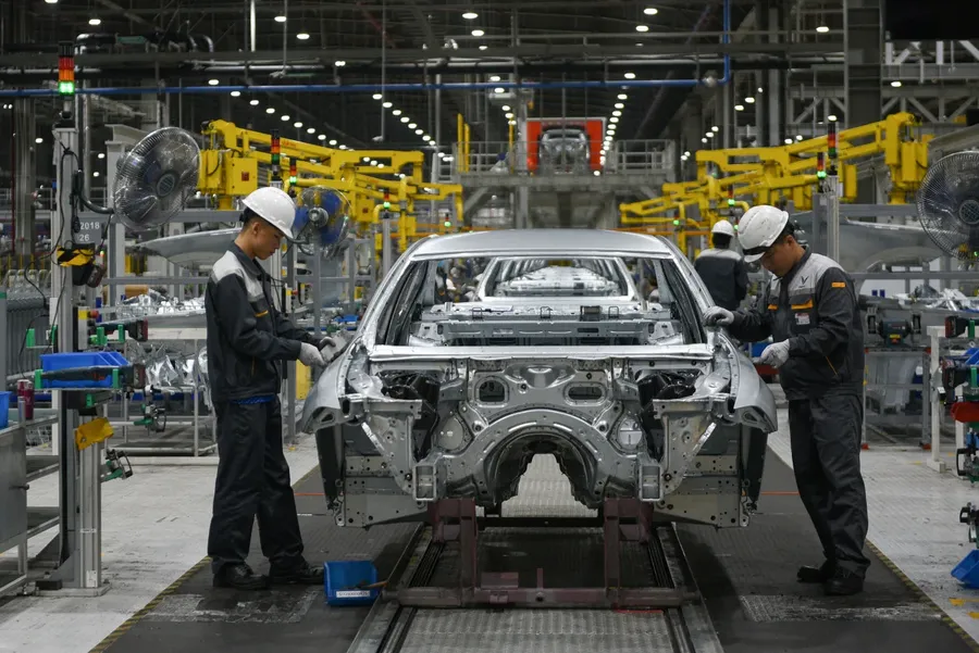 Vehicle assembly line illustrating the conversion of scale into cost efficiency