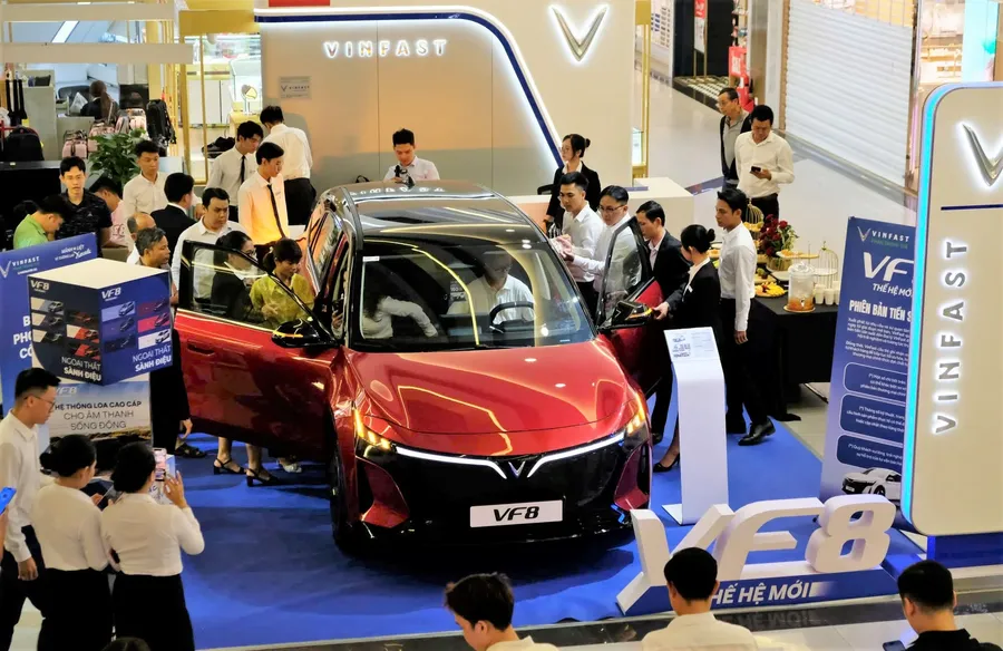 Customers experiencing VinFast vehicles at a showroom