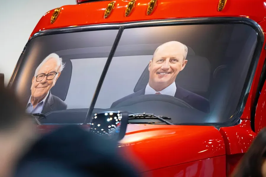 Greg Abel and Warren Buffett in a BNSF locomotive cab