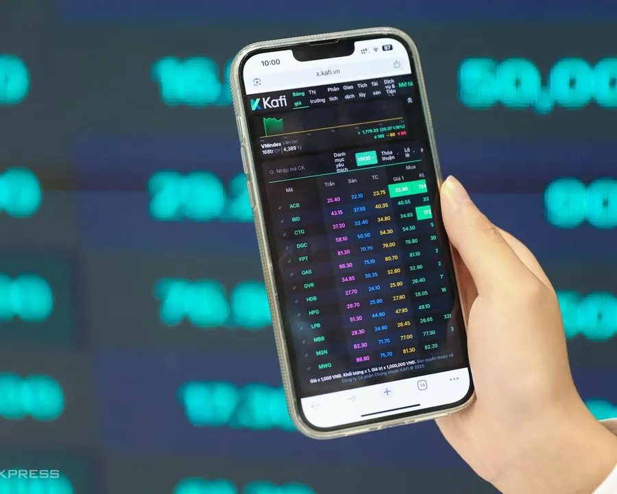 Individual investor checking a stock trading app on a phone
