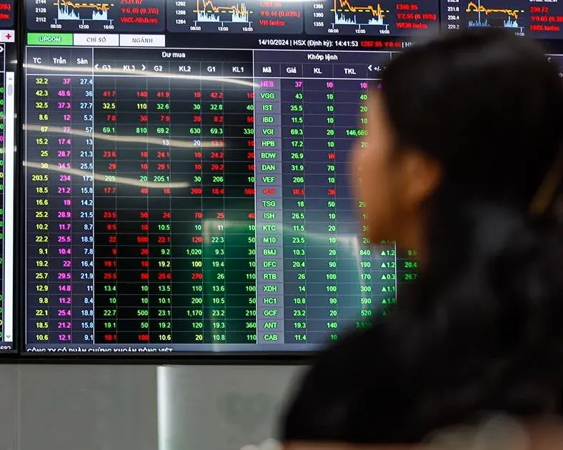 Investors watching a stock exchange board