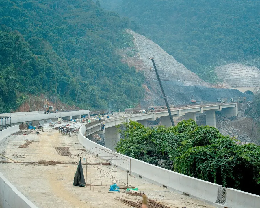 Mountain expressway construction site with an elevated bridge under construction