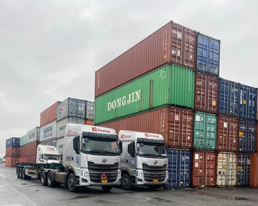 Container trucks hauling freight, representing sectors exposed to fuel cost pressure