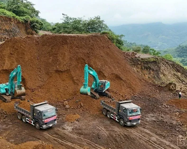 Excavators and trucks resume operations at the Quy Xa iron mine in Lao Cai