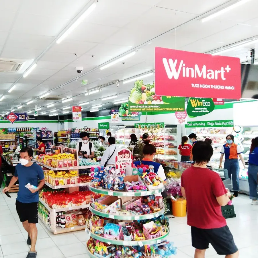 Inside a WinMart supermarket, consumer goods shelves and shoppers