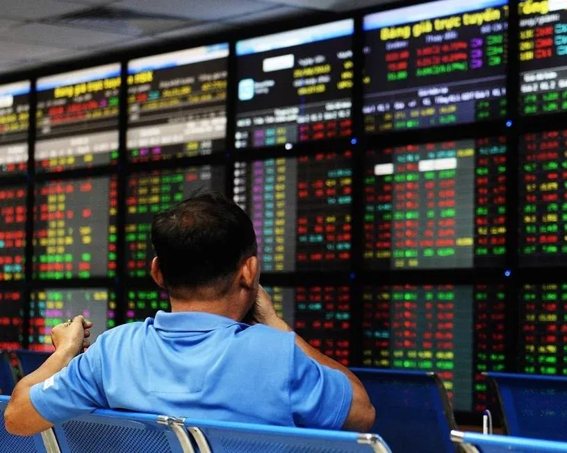 Investor watching a stock exchange board