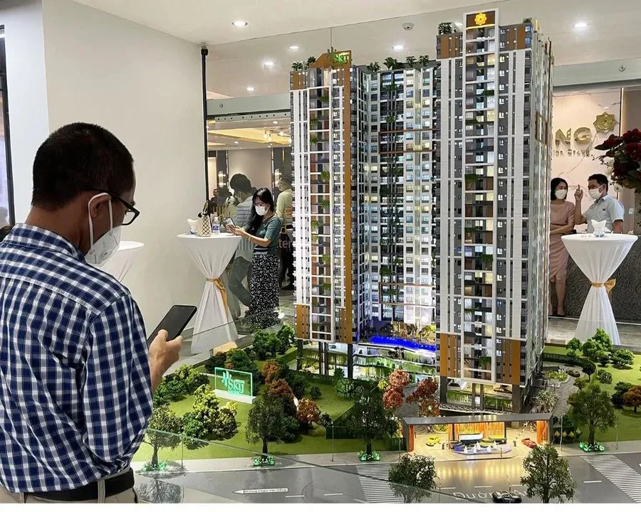 Customers signing a deposit contract at a real estate project
