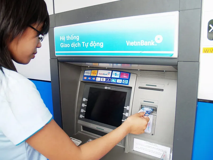 A customer using a VietinBank ATM