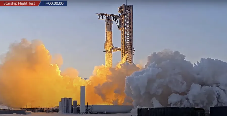 Tên lửa Starship trong một chuyến bay thử, đại diện cho mảng không gian của SpaceX